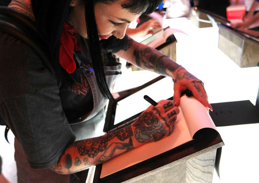 Famed Australia tattoo artist Lauren Winzer tests out the YogaBook.