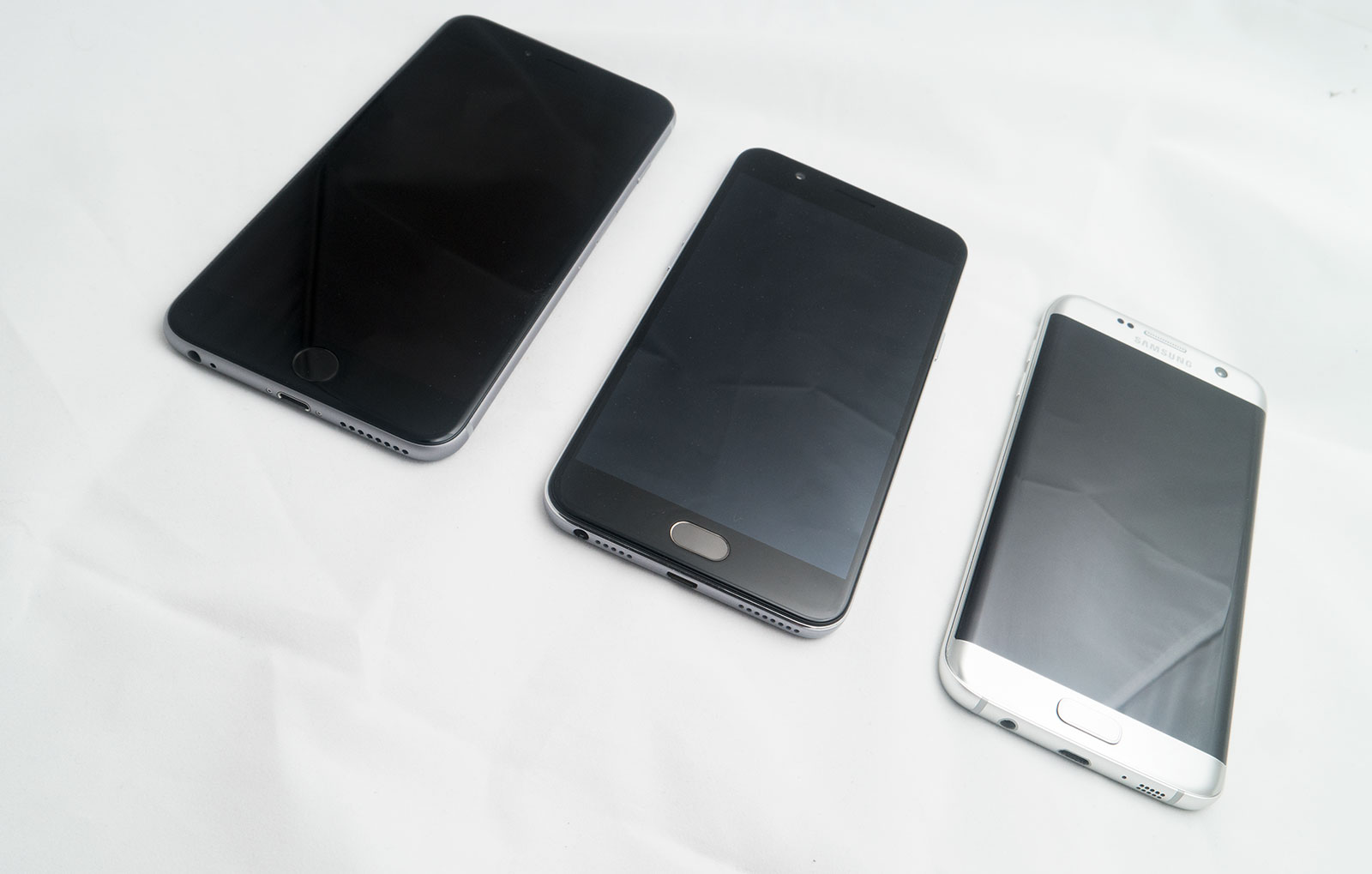 iPhone 6s Plus on the left, Oppo F1s in the middle, Samsung Galaxy S7 Edge on the right.