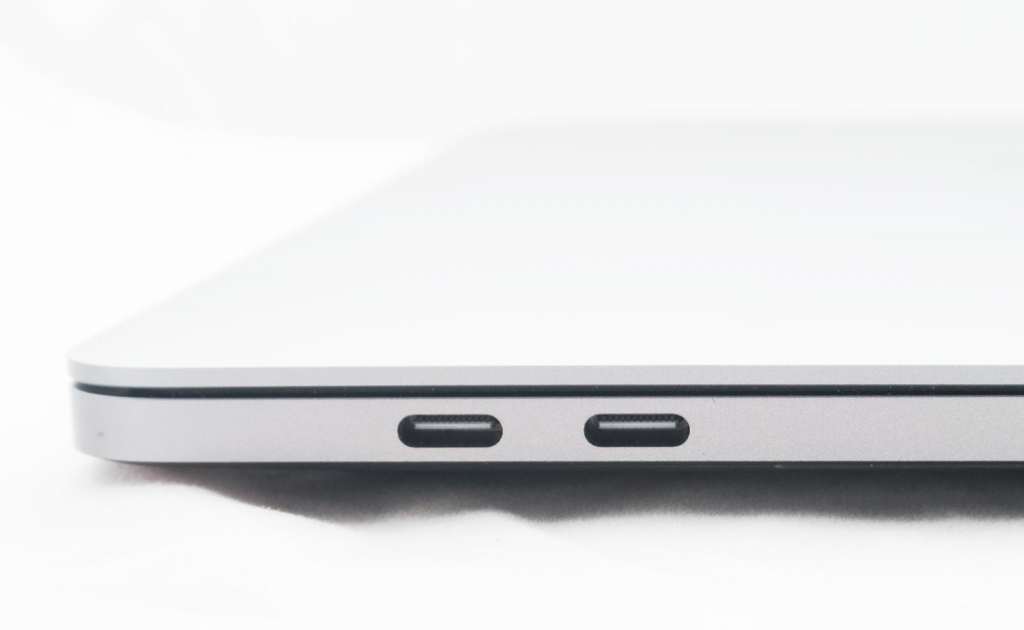 Four USB Type C and Thunderbolt 3 ports (two of which are shown here), but no SD card slot. It's not a deal breaker, but it is annoying if you're a photographer or videographer.