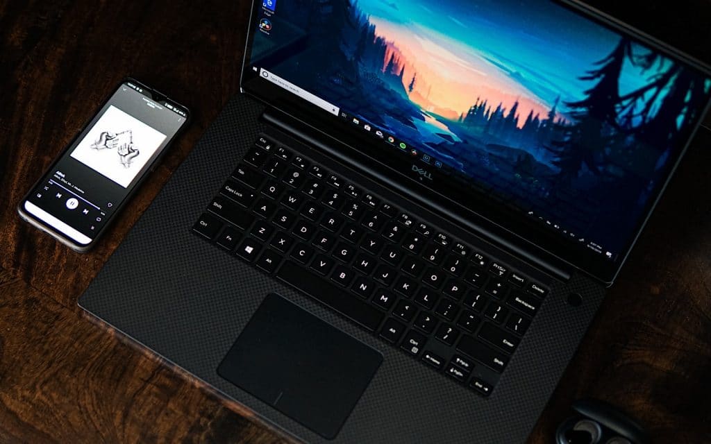 Phone and computer on a desk, working from home