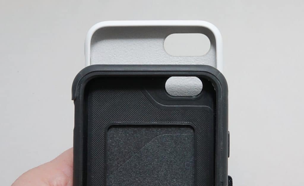 An iPhone SE 2020 case (top) above an older iPhone 6 or 7 case (bottom)