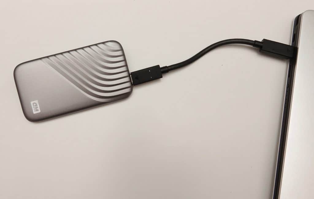 The WD My Passport SSD plugged into a computer.