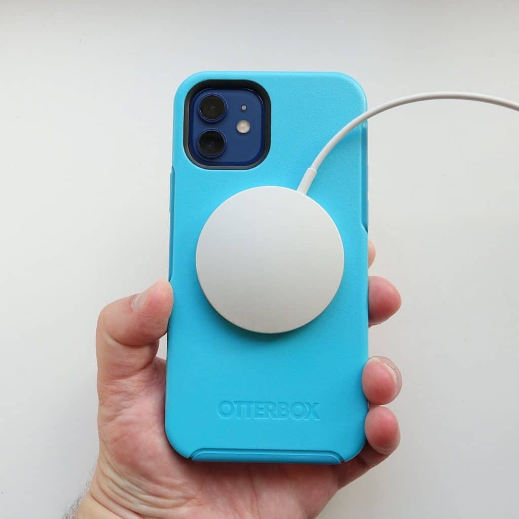 An OtterBox case on the iPhone 12 works with the MagSafe charger