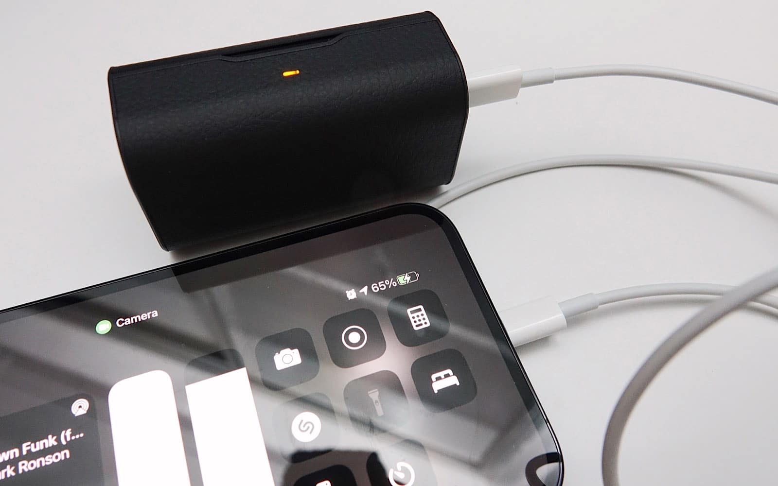 The Ag TWS04K can be used to recharge your phone, provided you have a cable.