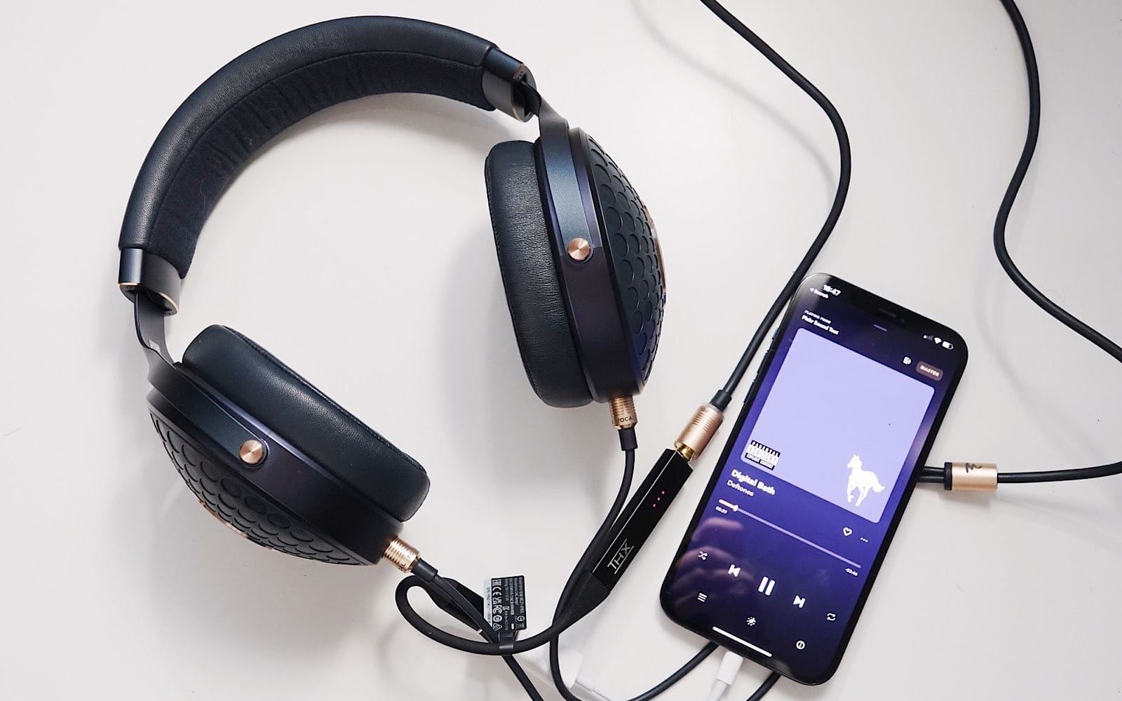 The Focal Celeste plugged into the THX Onyx through the iPhone USB to Lightning converter in an iPhone 12 Pro Max