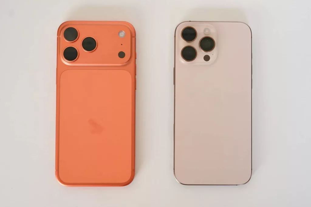 A difference in backs: the iPhone 17 Pro Max (left) sets the three-camera system in a camera bar, distinct to simply using the left corner in the iPhone 16 Pro Max (right).